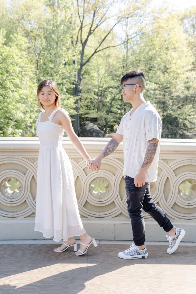 Walking across the Bow Bridge at Central Park, NYC