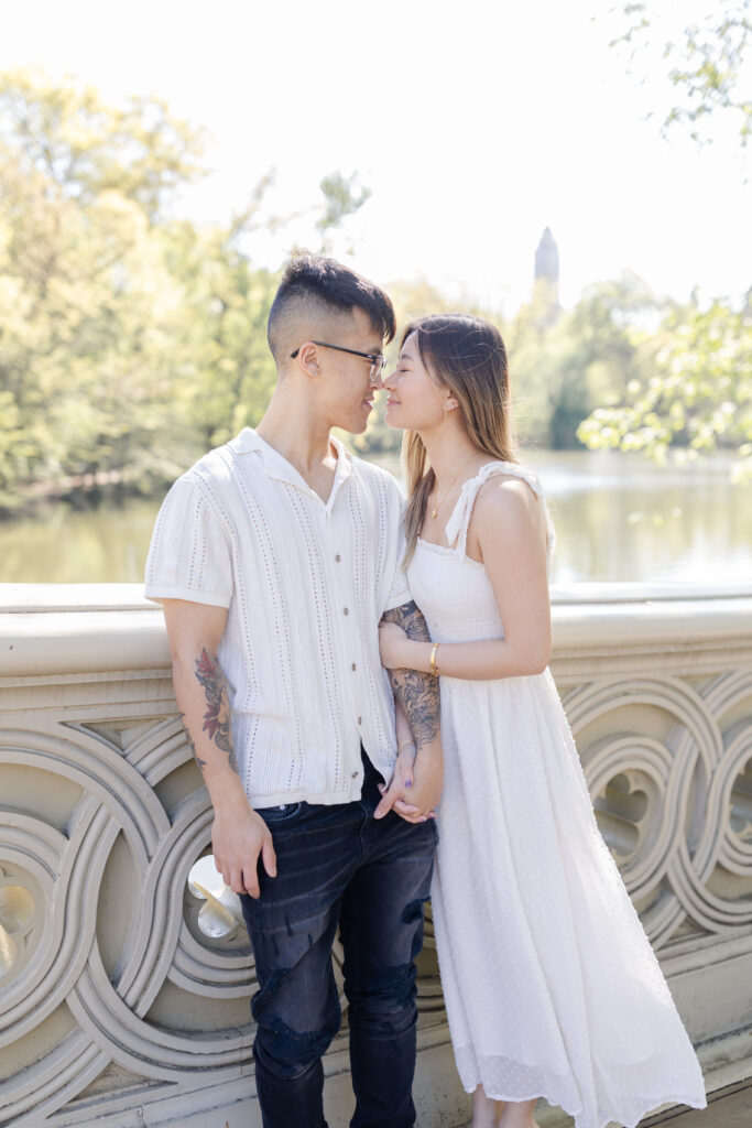 Couple on Bow Bridge against Waterview at Central Park