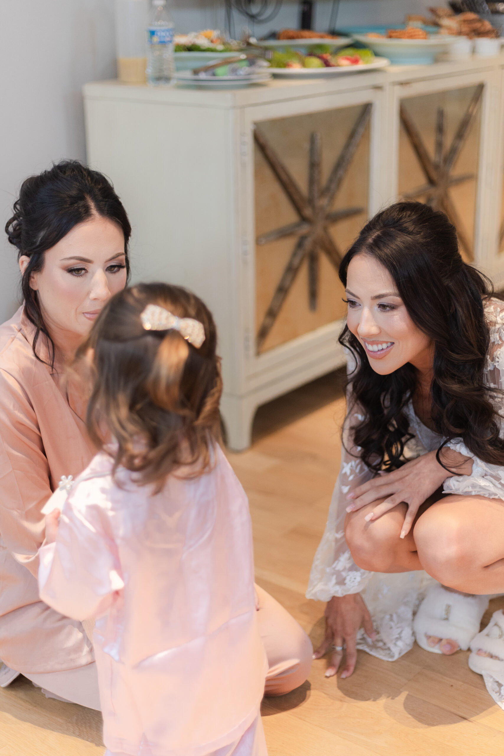 Bride and bridesmaid relaxing at the bridal suite in the NJ Vineyard Wedding Venue