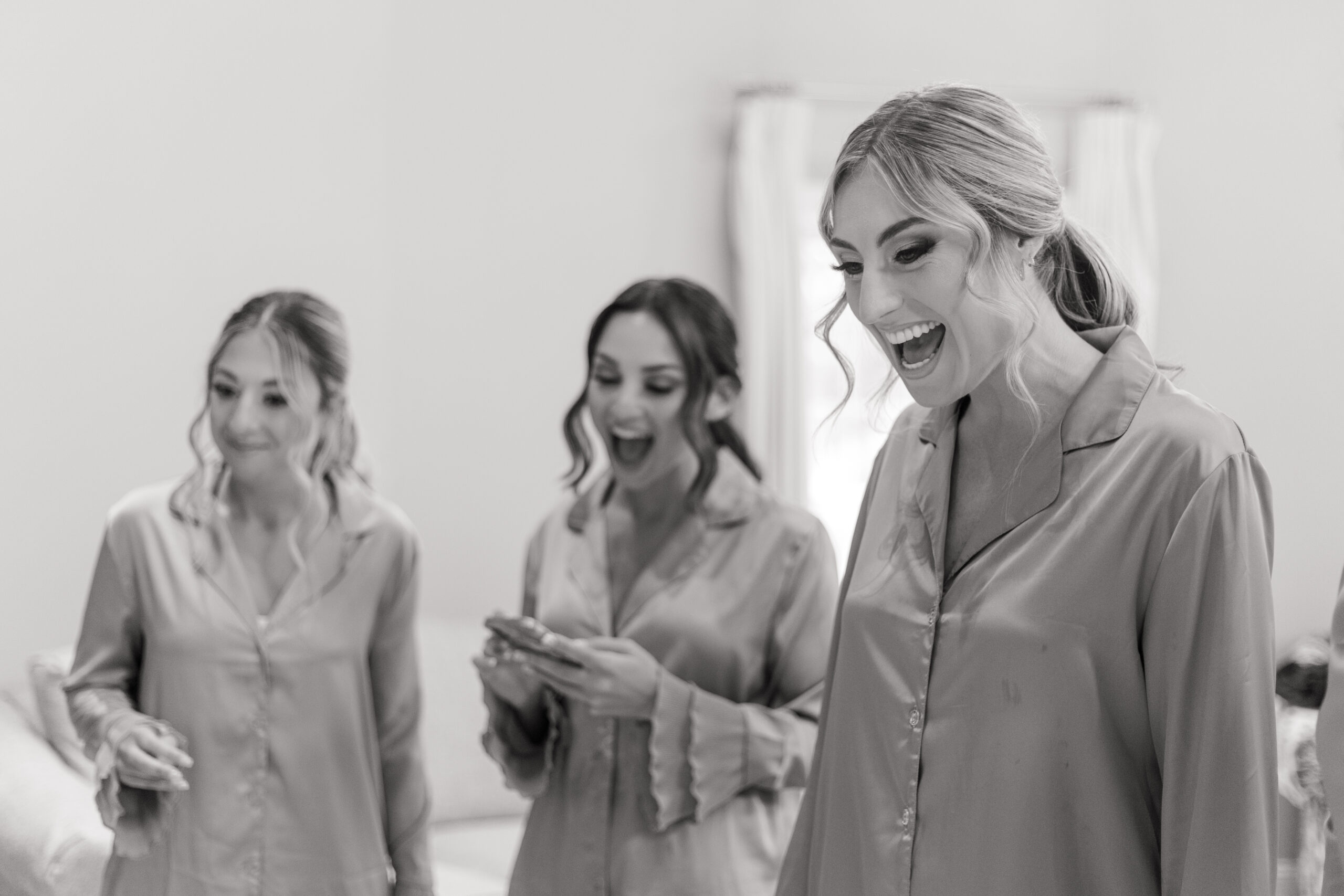 Bride and bridesmaid relaxing at the bridal suite in the NJ Vineyard Wedding Venue