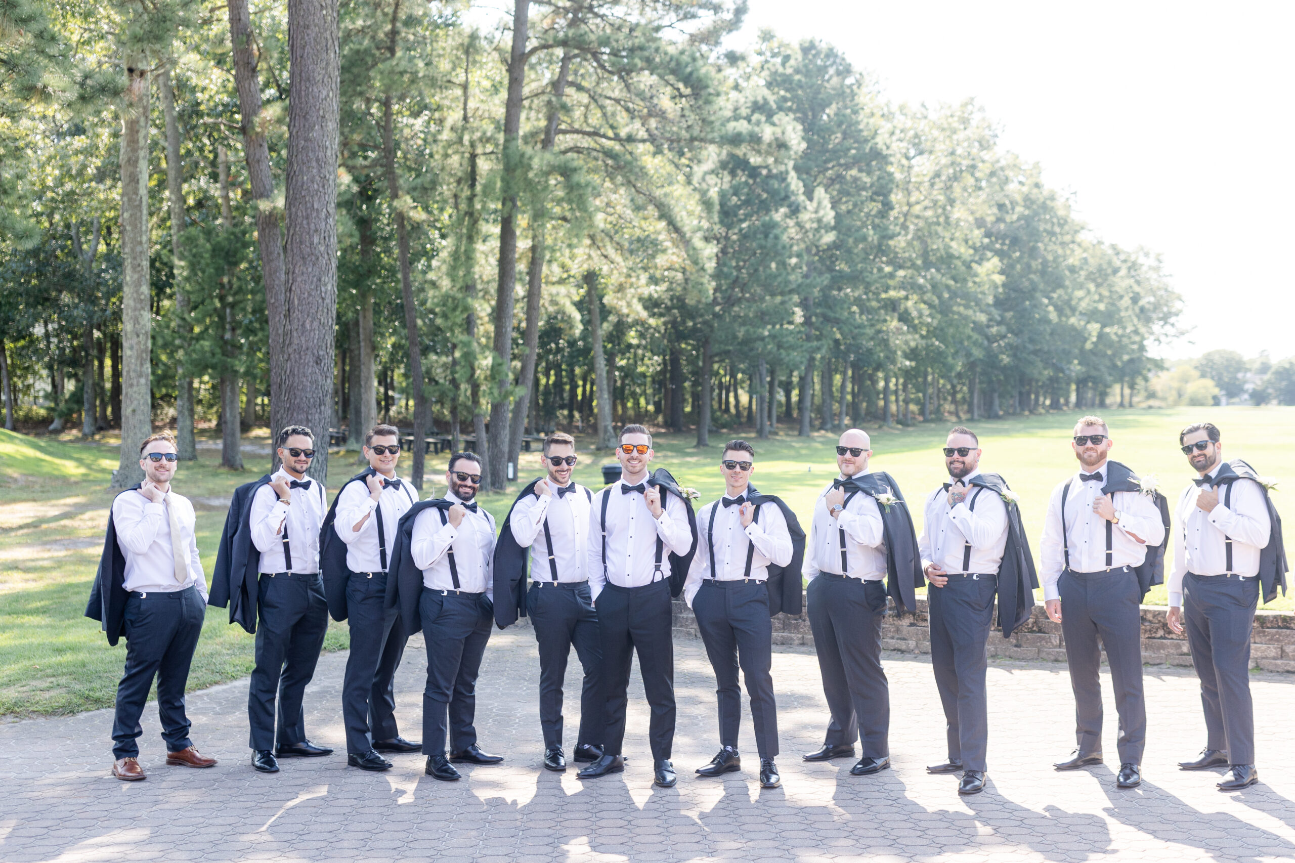 Groom and groomsmen in front of golf course wedding venue