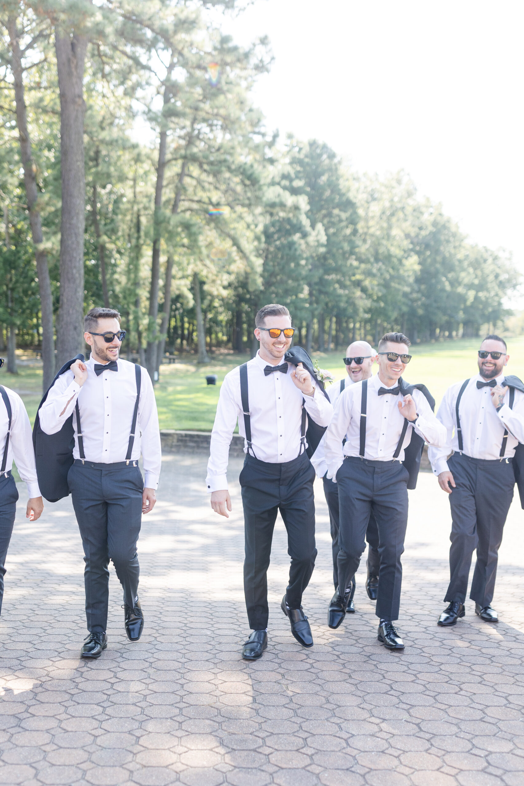 Groom and groomsmen in front of golf course wedding venue