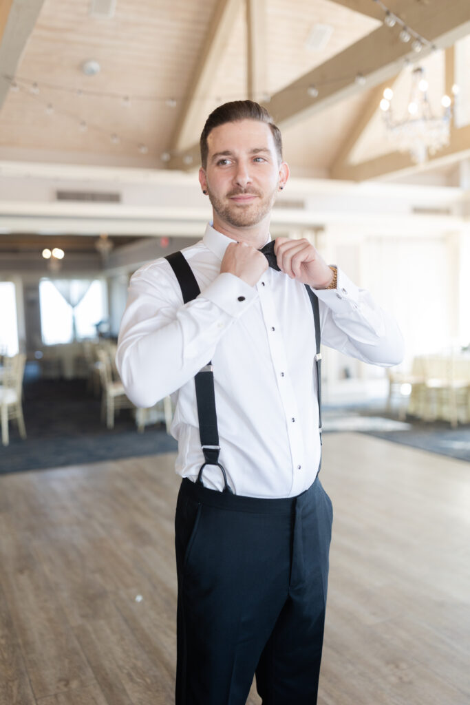 Groom getting ready at golf club wedding venue