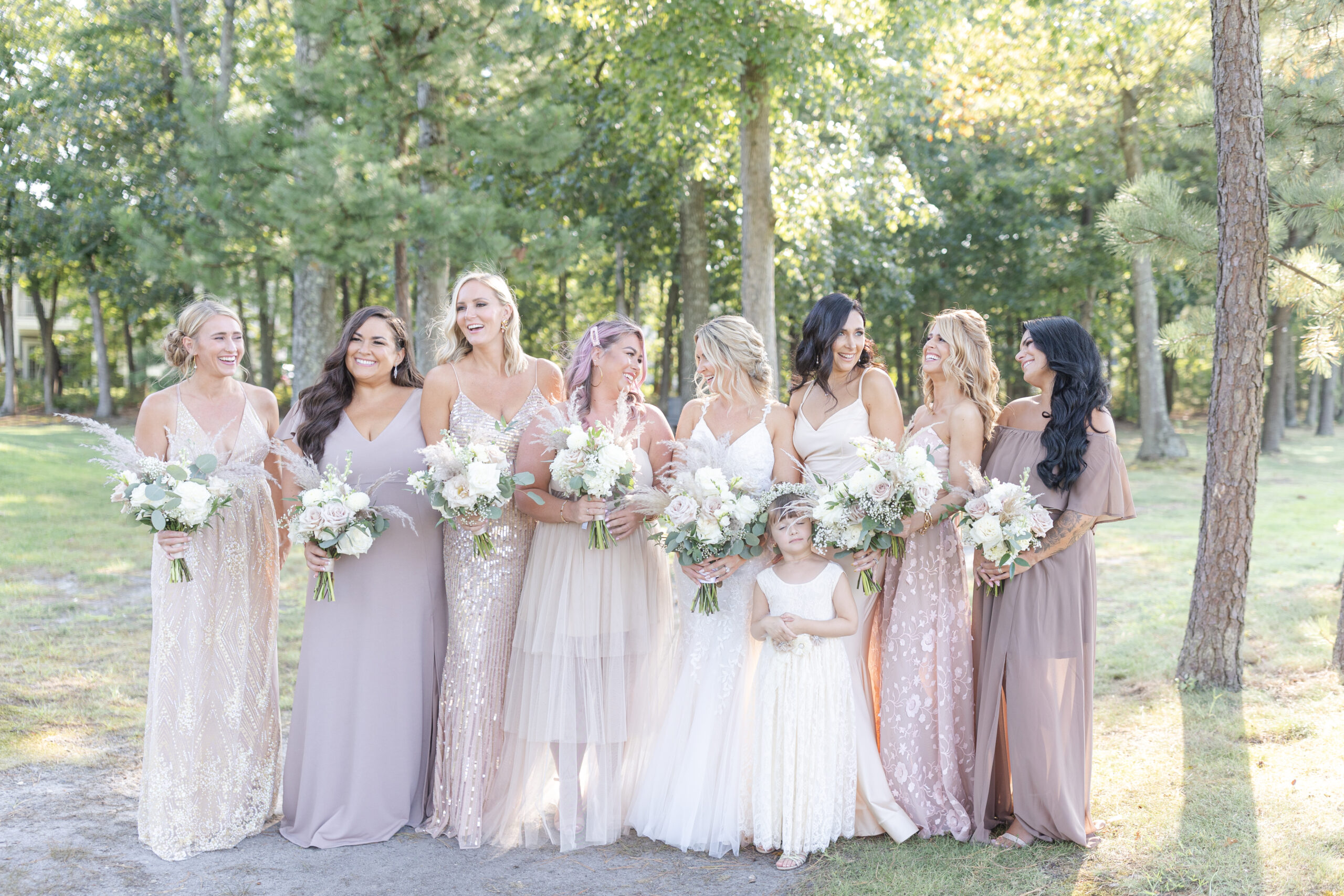 Bride and bridal party in front of golf course wedding venue