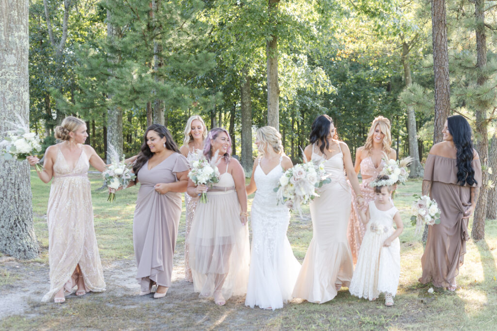 Bride and bridal party in front of golf course wedding venue