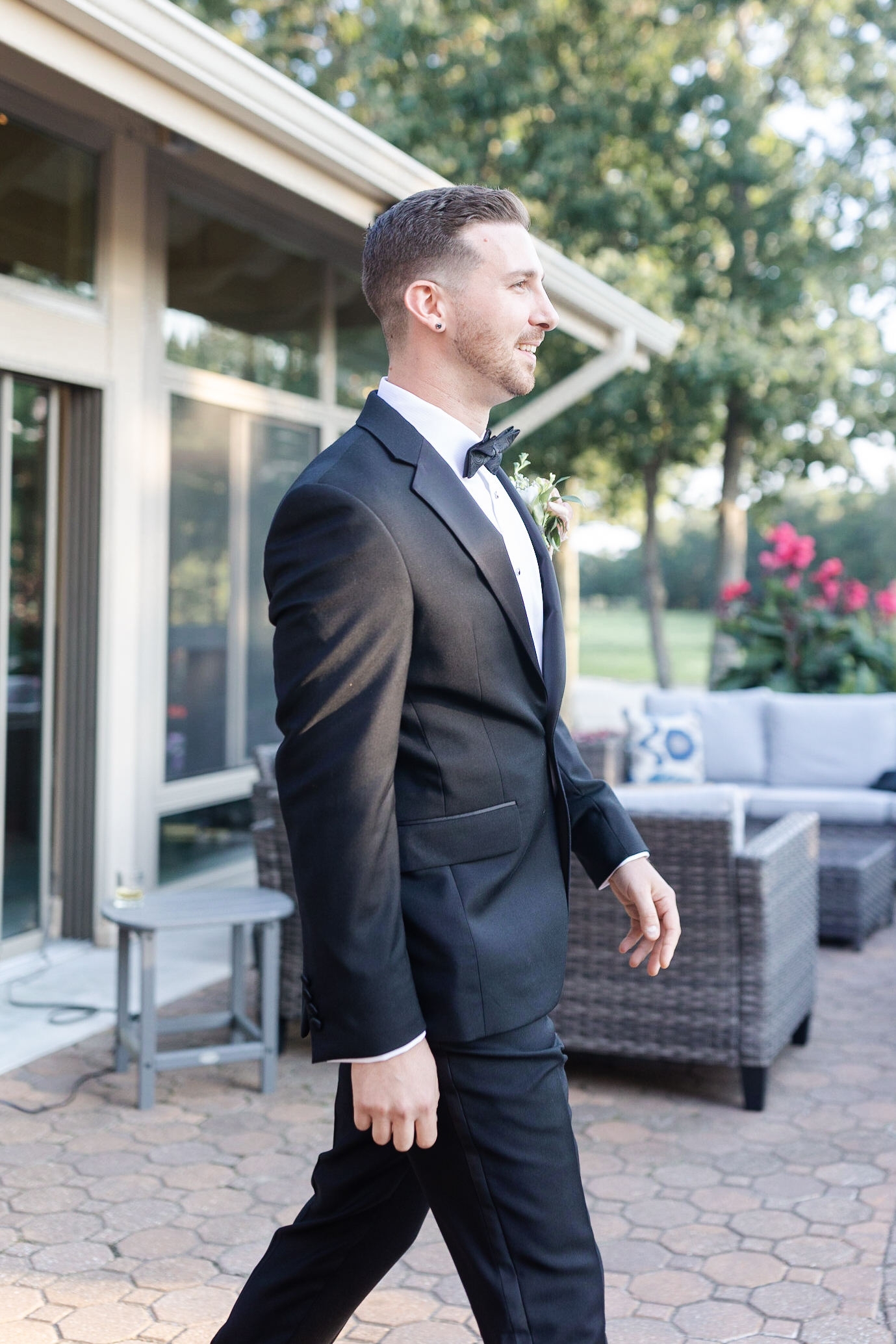 Groom walking in during wedding ceremony at golf course wedding venue