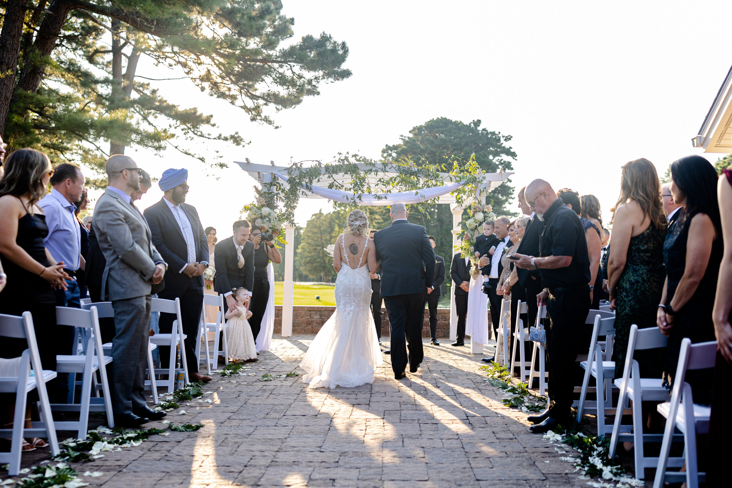 Bride walking down the aisle of wedding ceremony