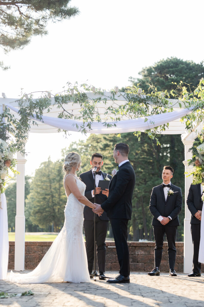 Bride and groom during outdoor wedding ceremony