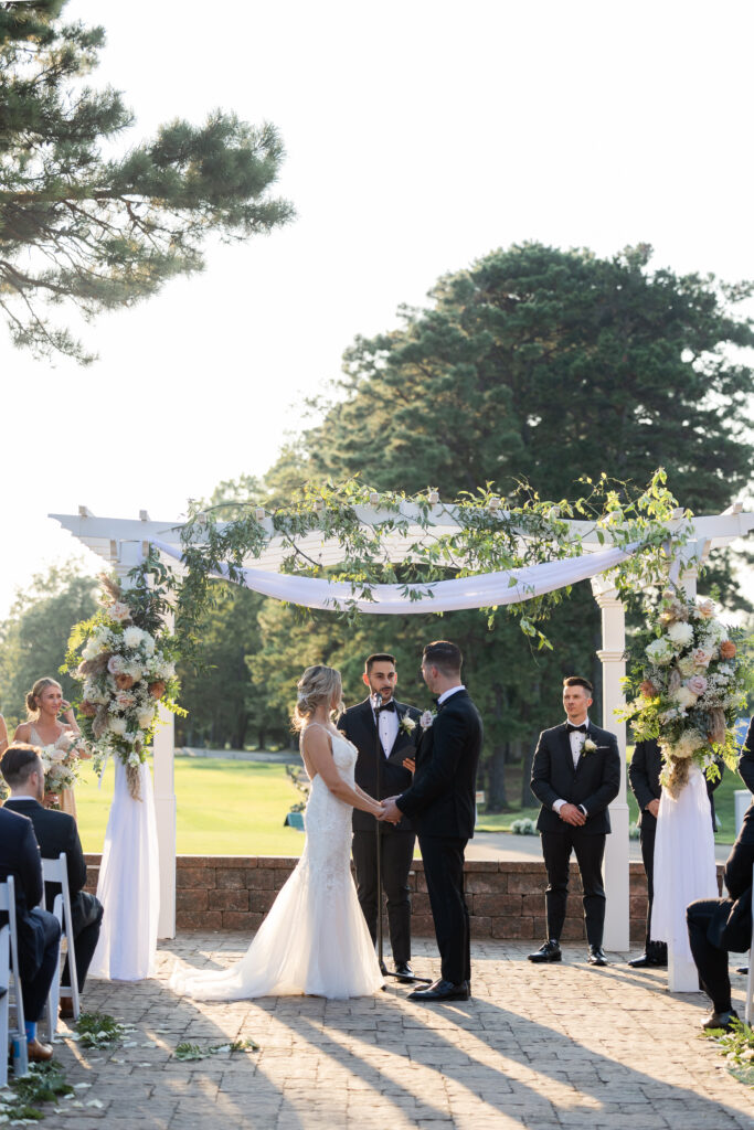 Bride and groom during outdoor wedding ceremony