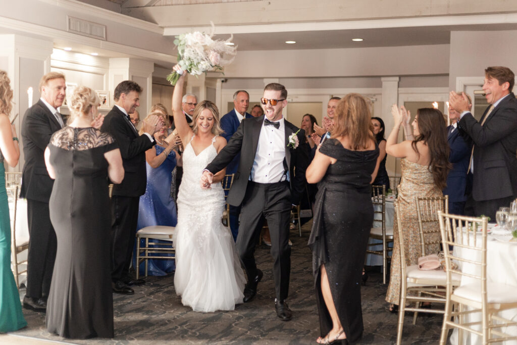 Bride and groom first dance inside golf club wedding venue