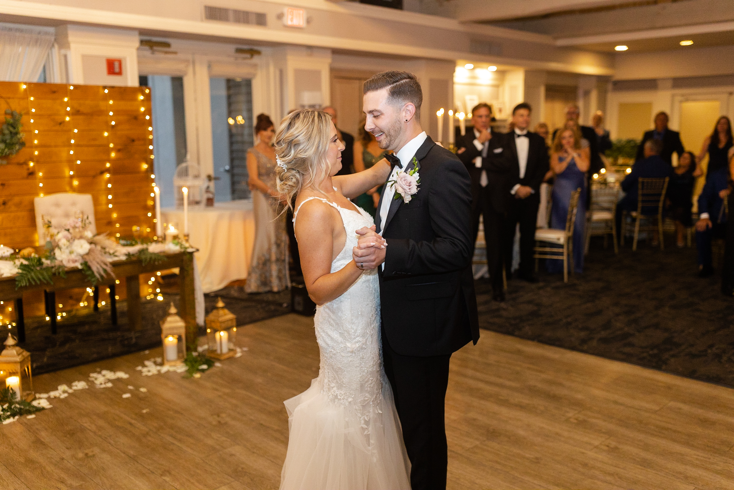 Bride and groom first dance inside golf club wedding venue