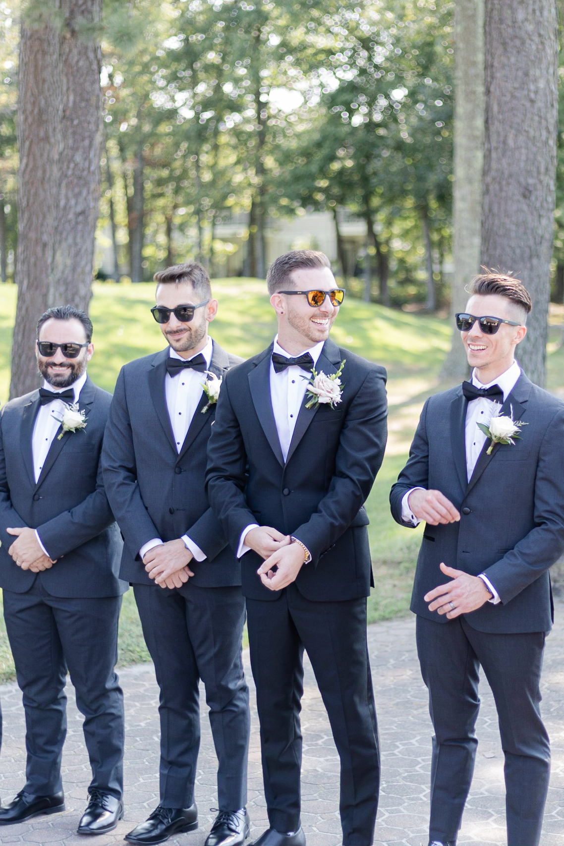 Groom and groomsmen in front of golf course wedding venue