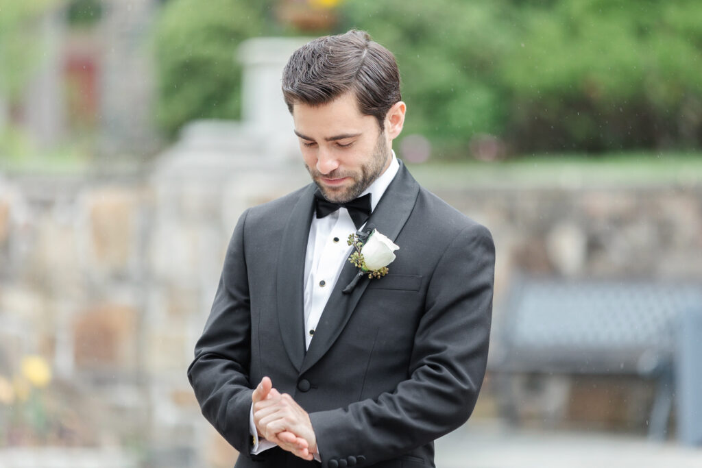 Groom waiting outside of chateau wedding venue