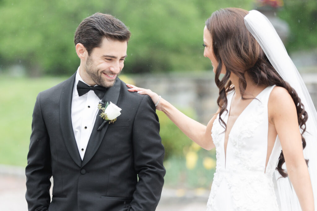 First look moment between bride and groom outside of chateau wedding venue