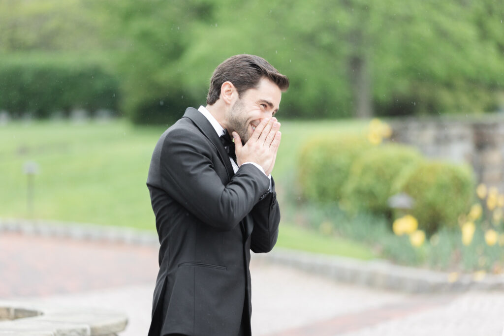 First look moment between bride and groom outside of New Jersey castle wedding venue