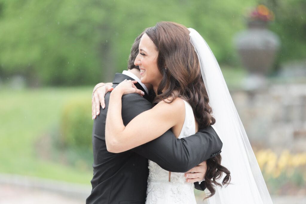 First look moment between bride and groom outside of chateau wedding venue