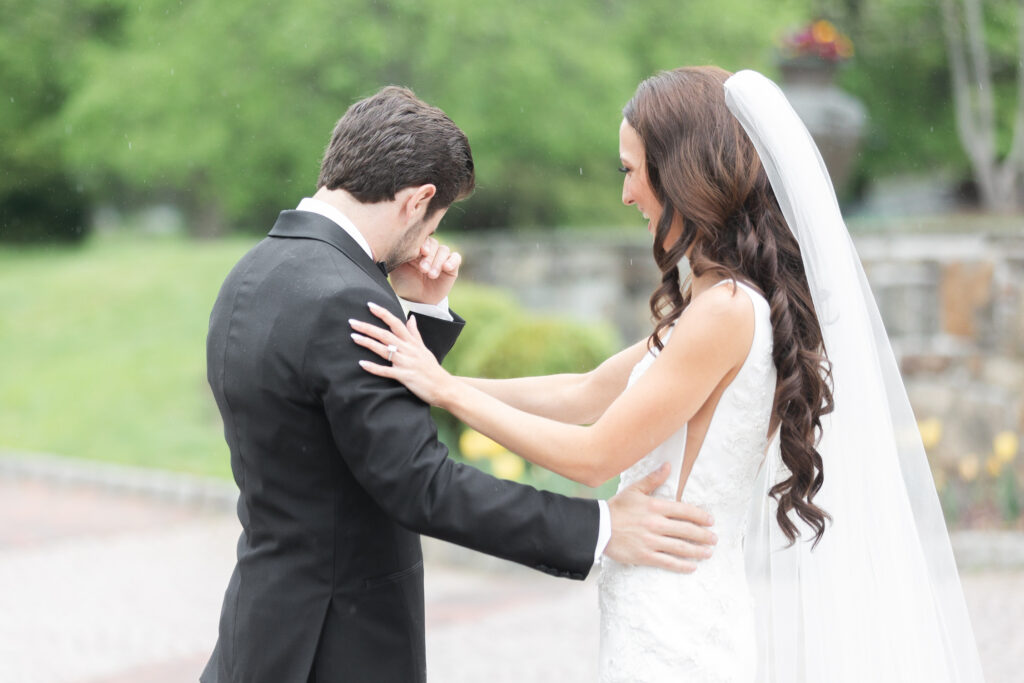 First look moment between bride and groom outside of New Jersey castle wedding venue