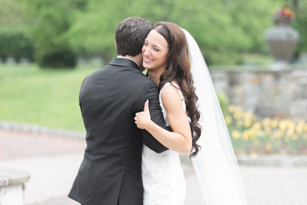 First look moment between bride and groom outside of chateau wedding venue