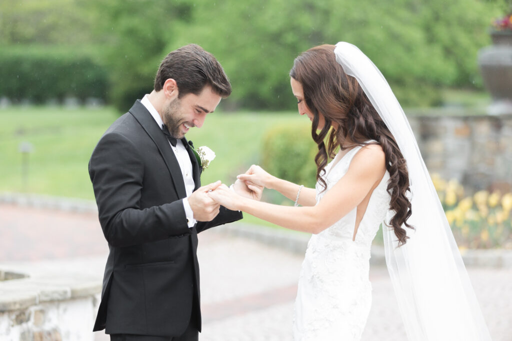 First look moment between bride and groom outside of chateau wedding venue