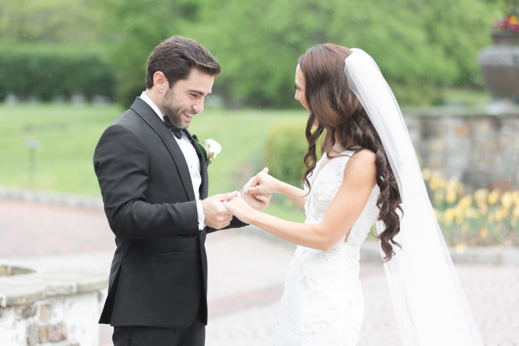 First look moment between bride and groom outside of New Jersey castle wedding venue