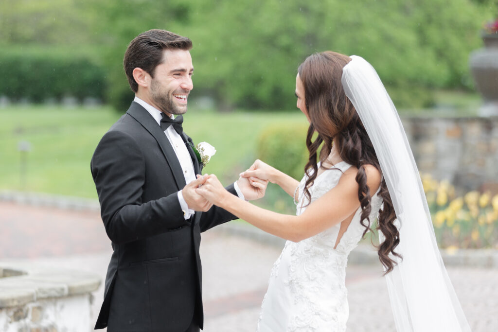 First look moment between bride and groom outside of chateau wedding venue