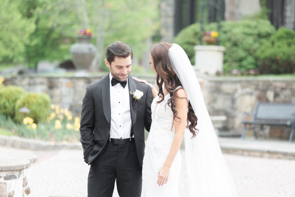 First look moment between bride and groom outside of New Jersey castle wedding venue