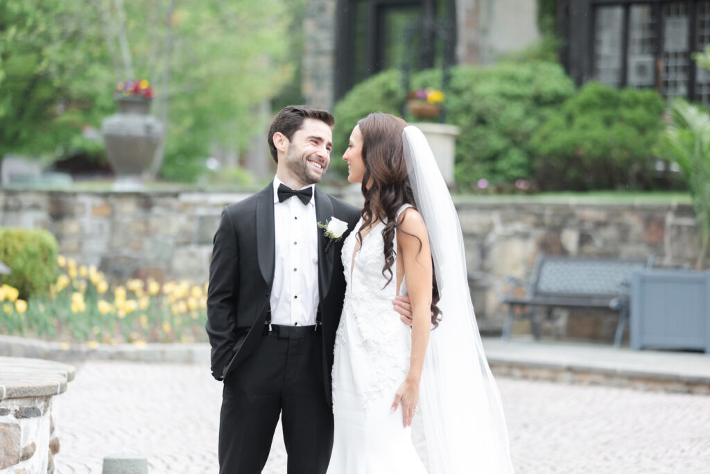 First look moment between bride and groom outside of New Jersey castle wedding venue