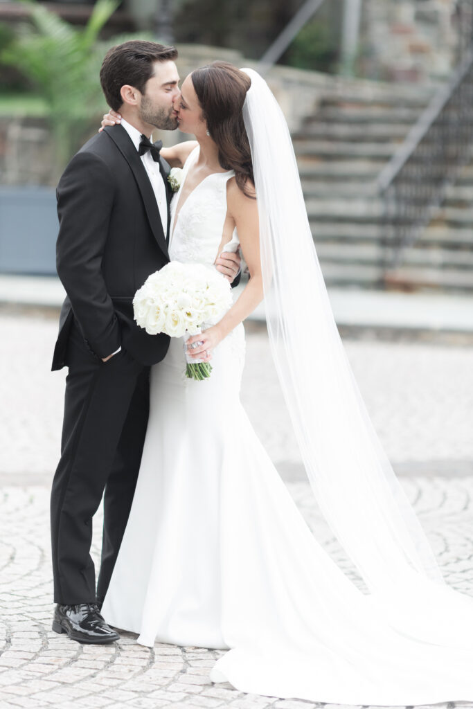 Bride and groom in front of New Jersey Castle Wedding venue