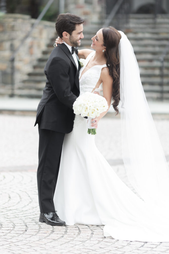 Bride and groom in front of New Jersey Castle Wedding venue