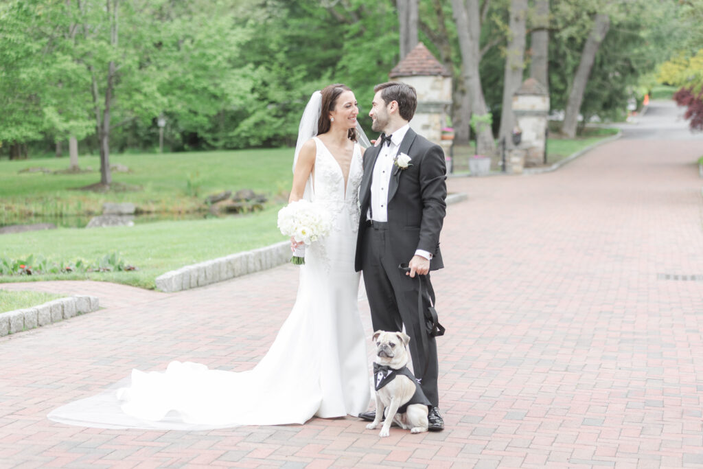 Bride, groom and their dog outdoor wedding portraits in northern New Jersey wedding venue