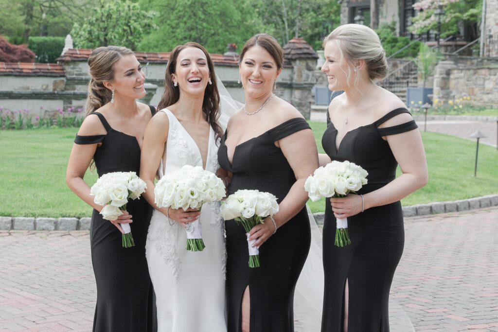 Bride and bridal party outside chateau wedding venue