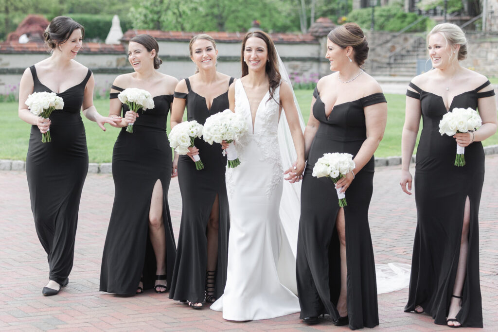 Bride and bridal party outside chateau wedding venue