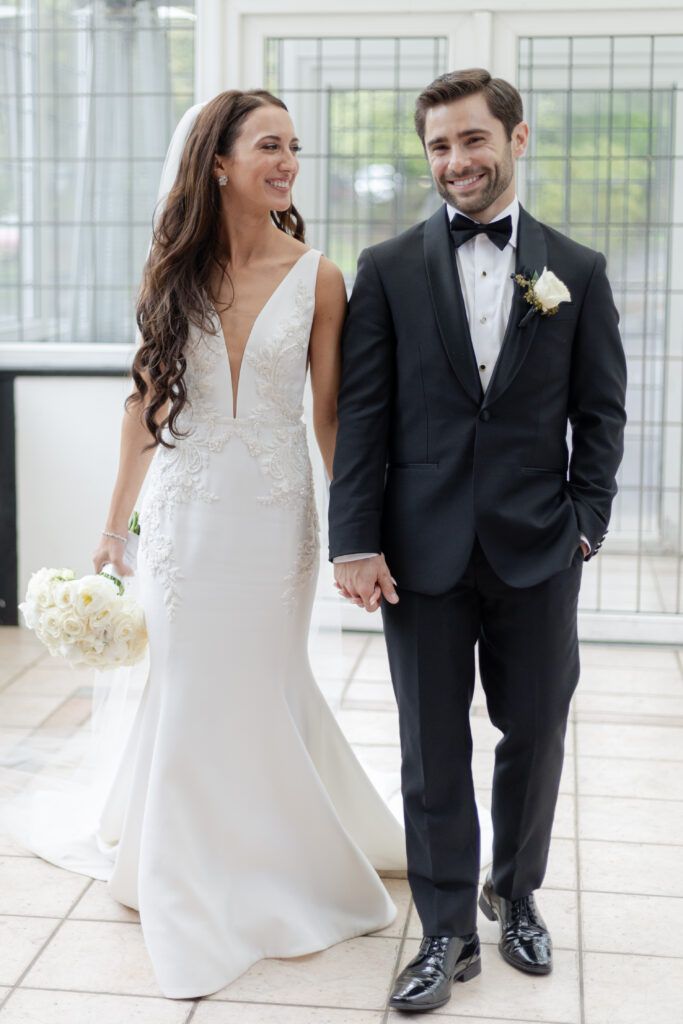 Bride and groom inside Pleasantdale Chateau Greenhouse