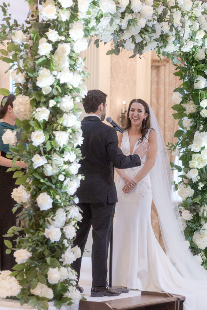 Bride and groom at wedding ceremony inside Pleasantdale Chateau