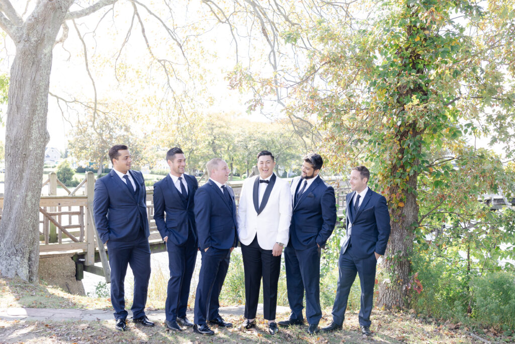 Groom and groomsmen at Spring Lake, New Jersey, at Divine Park