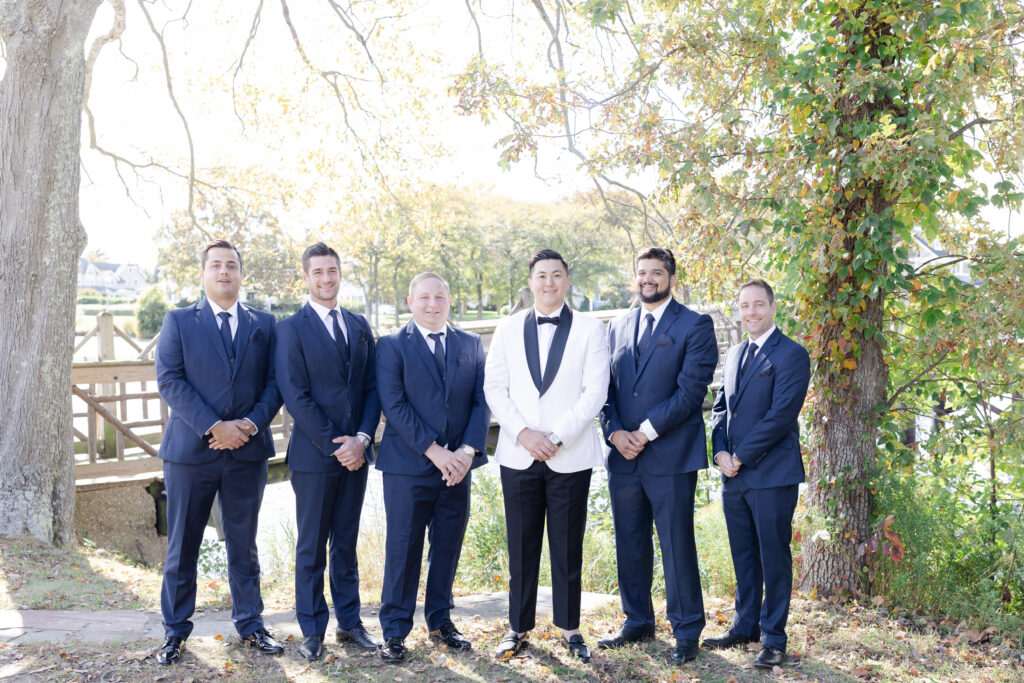 Groom and groomsmen at Spring Lake, New Jersey, at Divine Park 