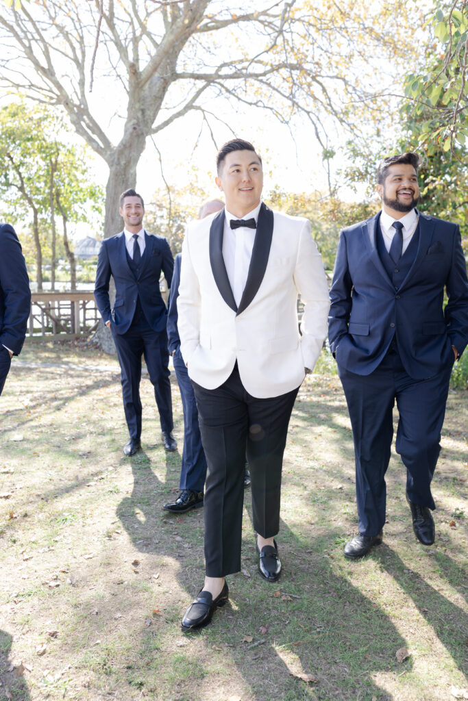 Groom and groomsmen at Spring Lake, New Jersey, at Divine Park