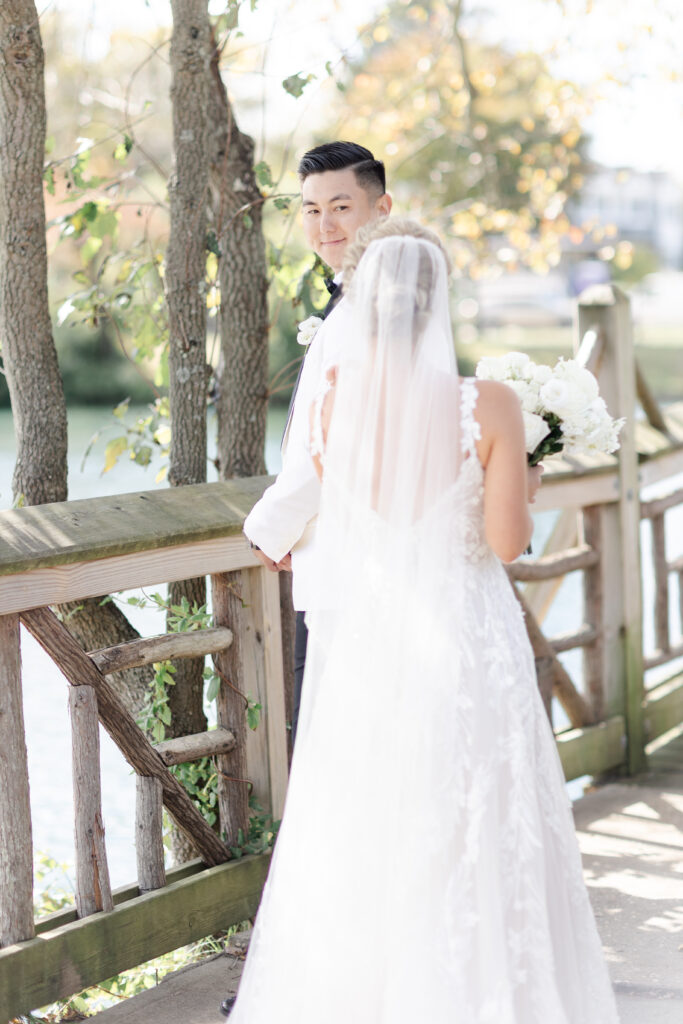 Outdoor first look with bride and groom at Divine Park