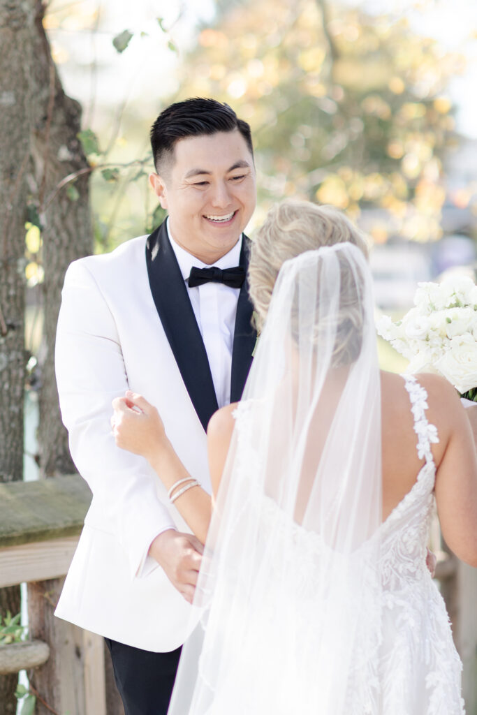 Outdoor first look with bride and groom at Divine Park