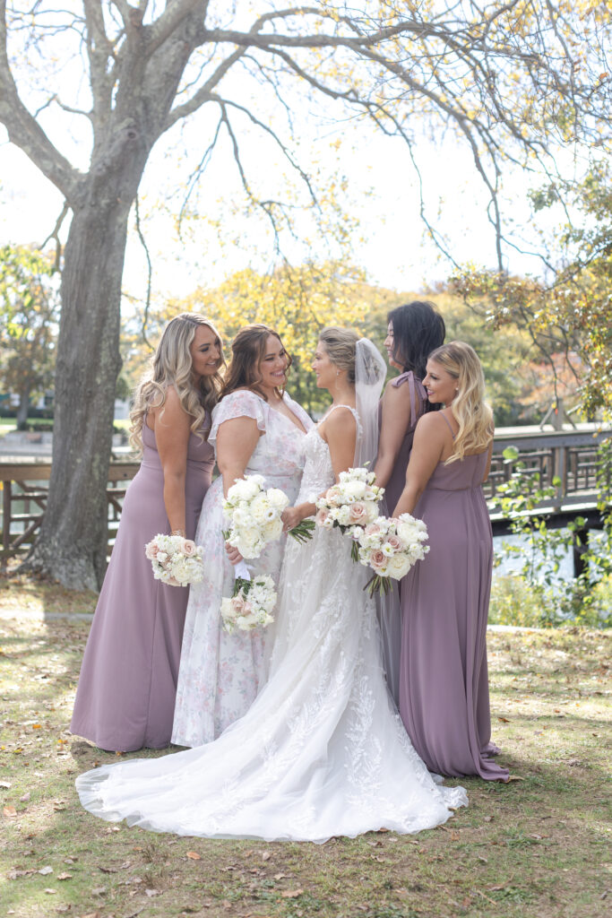 Bride and bridal party in front of Wooden Bridge at Divine Park