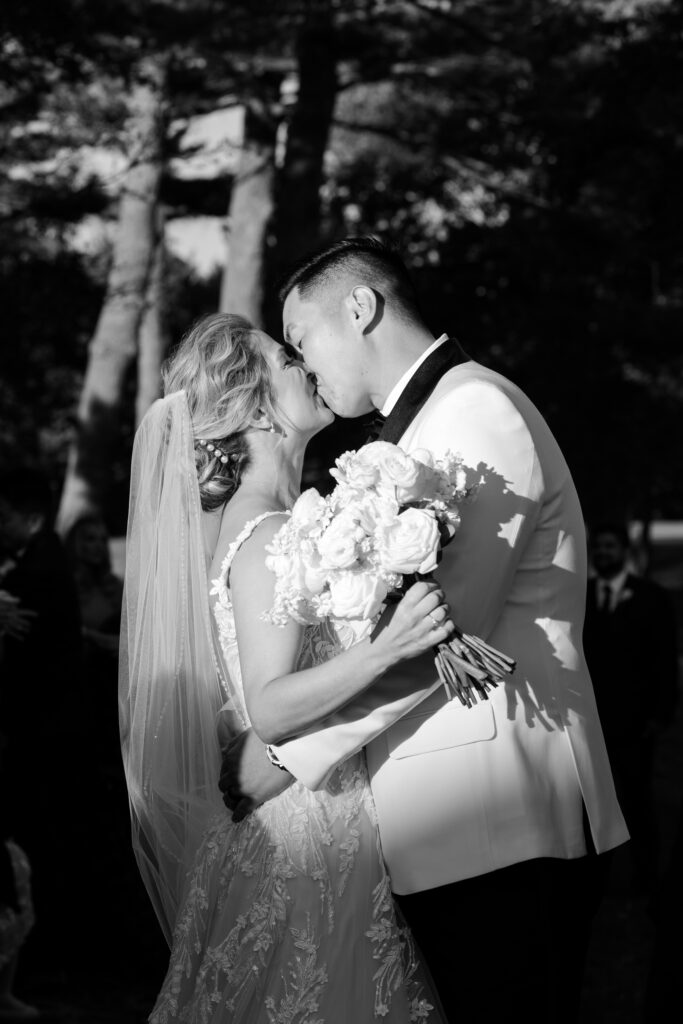 Bride and groom just married aisle kiss at wedding ceremony