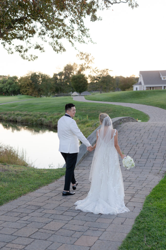 Bride and groom sunset photos at golf club wedding venue