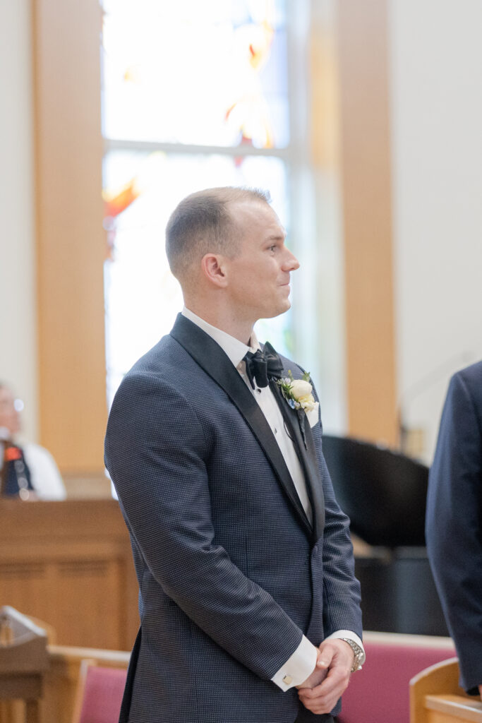 Groom at church altar