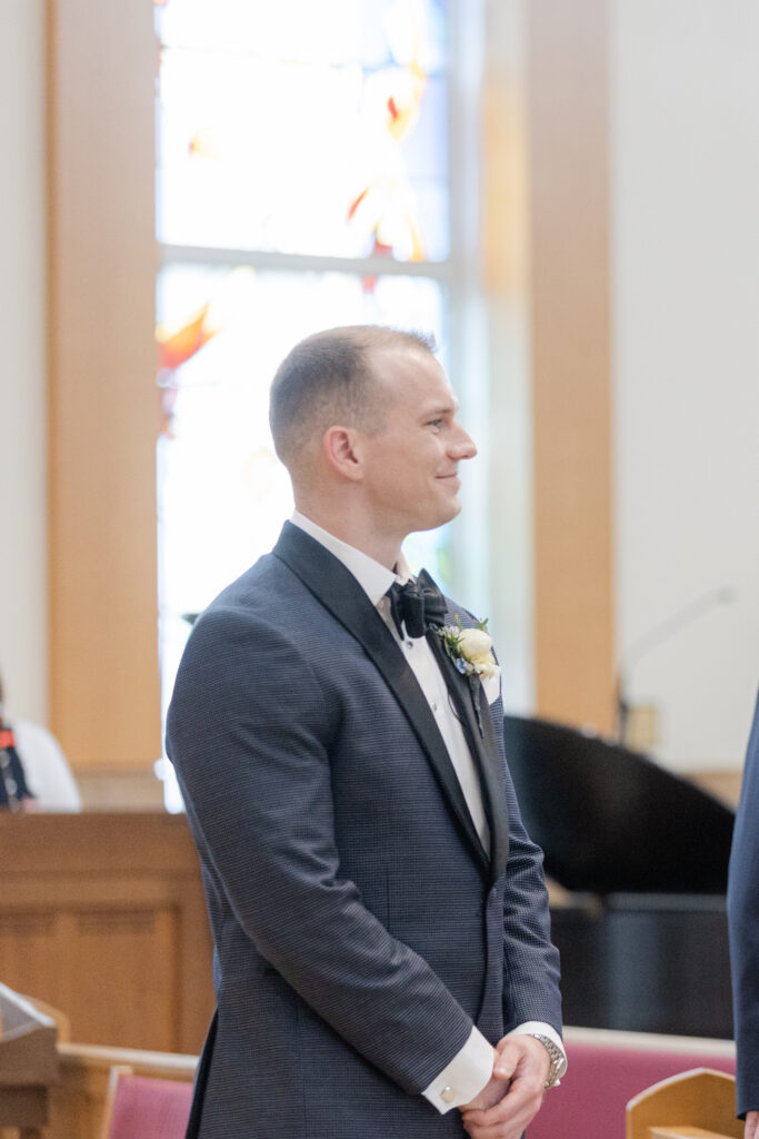 Groom at church altar