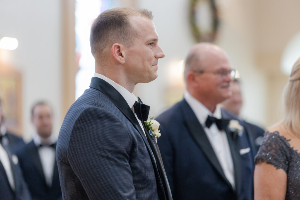 Groom at church altar