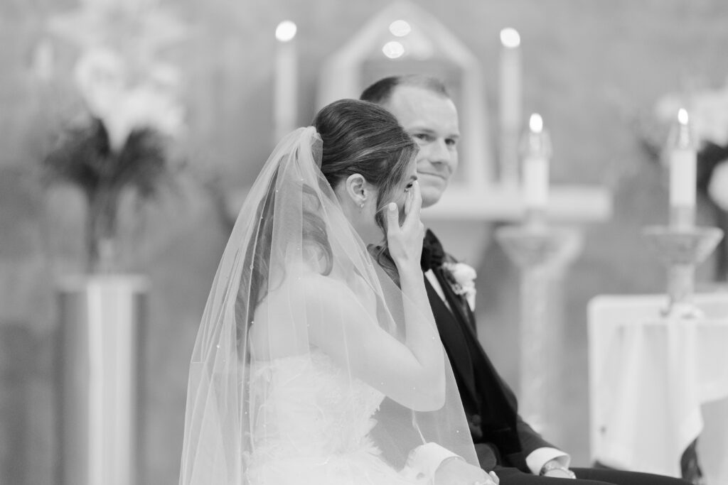 Bride tearing up during wedding ceremony