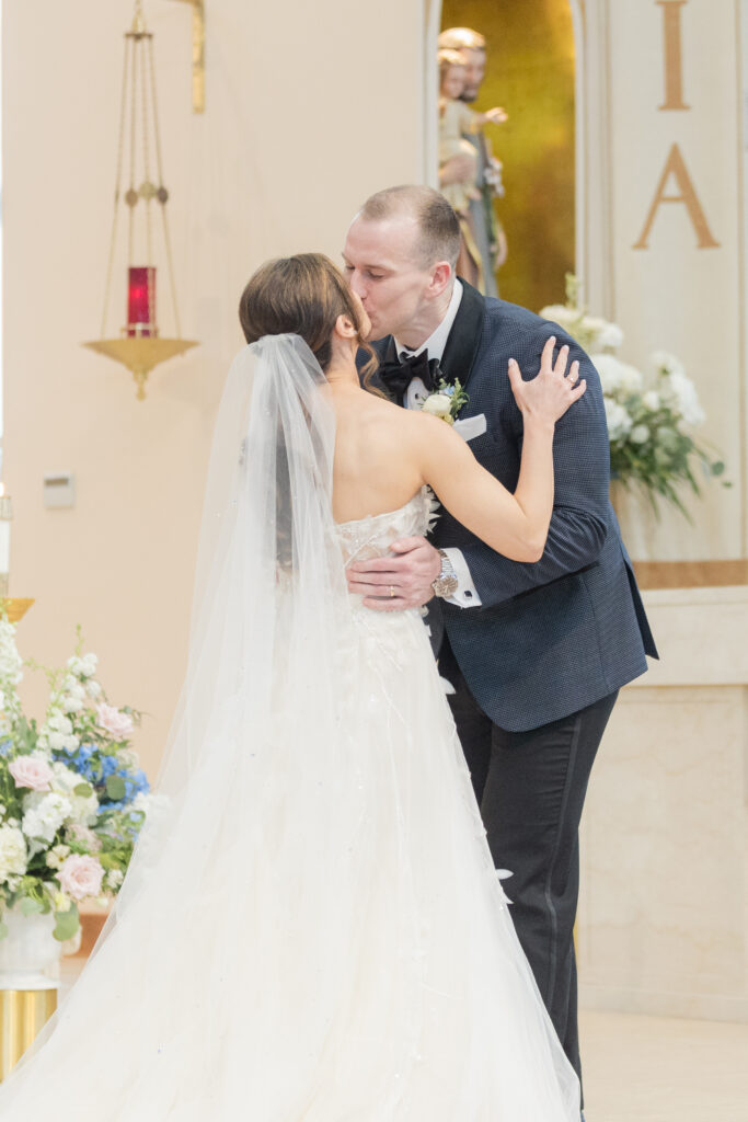 Bride and groom first kiss