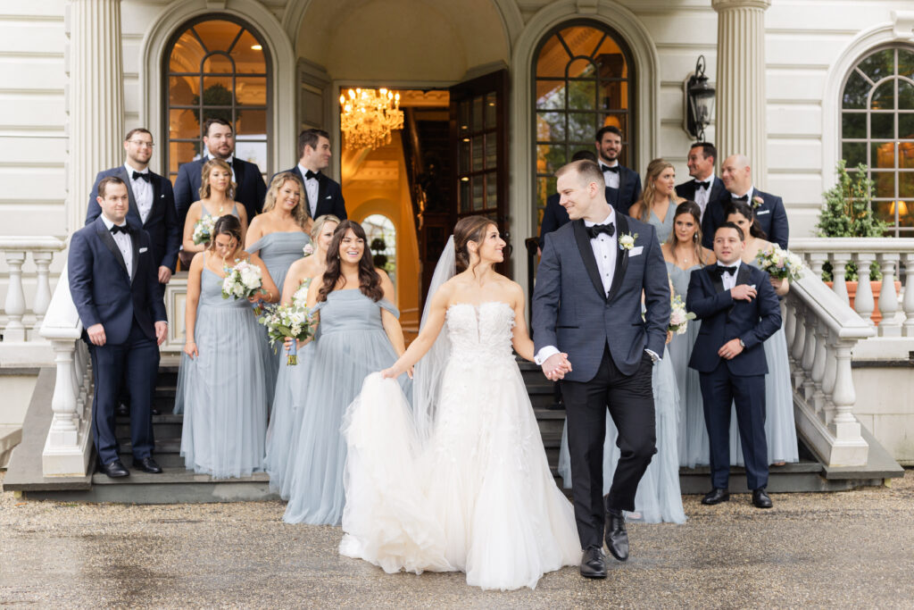 Bride and groom with wedding party in front of Ashford Estate