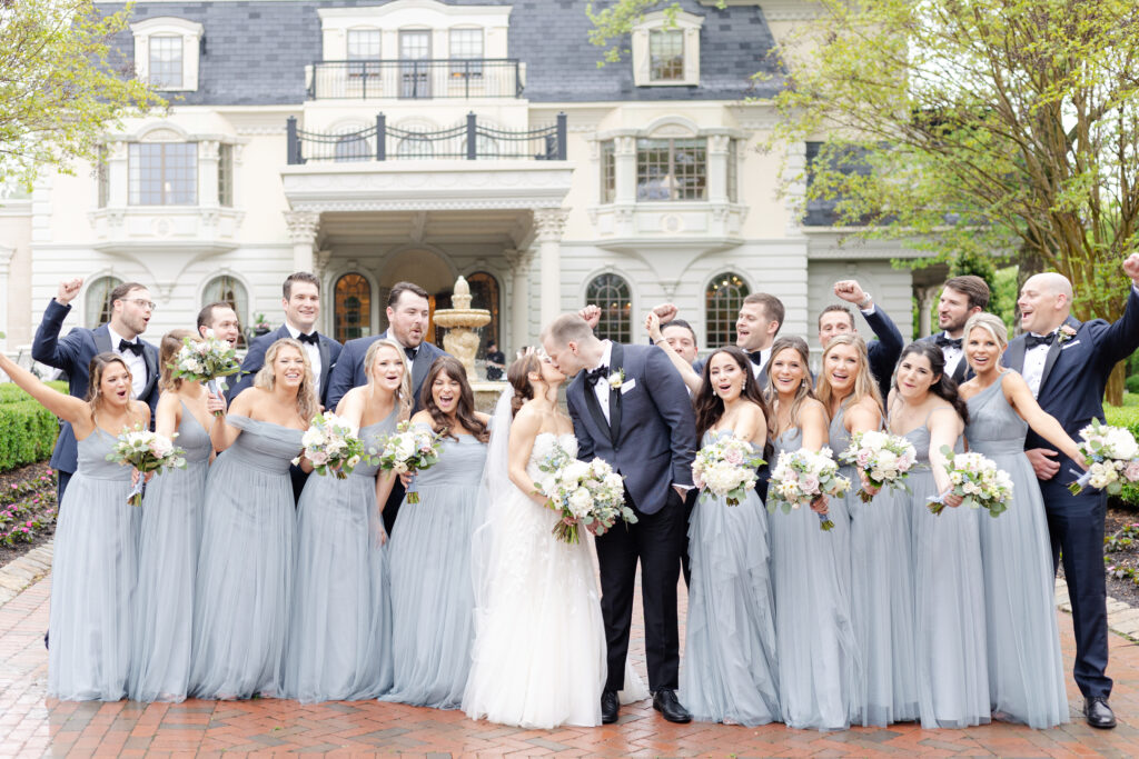 Bride and groom with wedding party in front of Ashford Estate