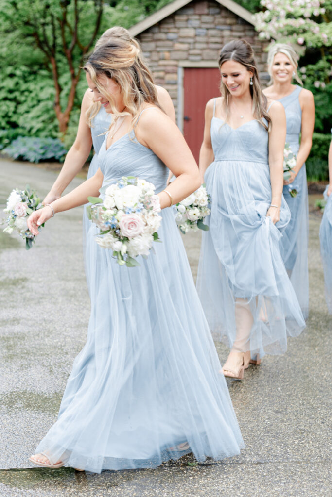 Bridal party walking out of the Red Barn